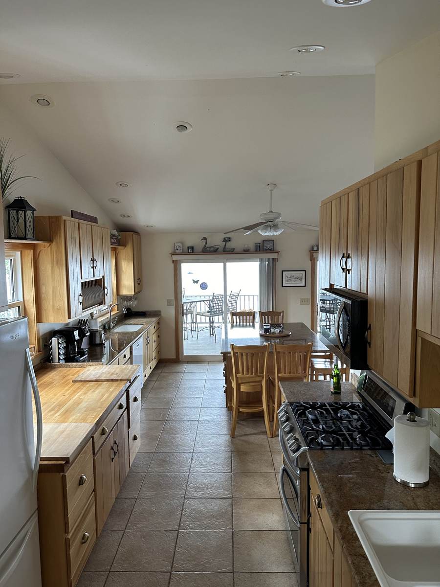 Fully equipped kitchen with a gas range and butcher-block counter