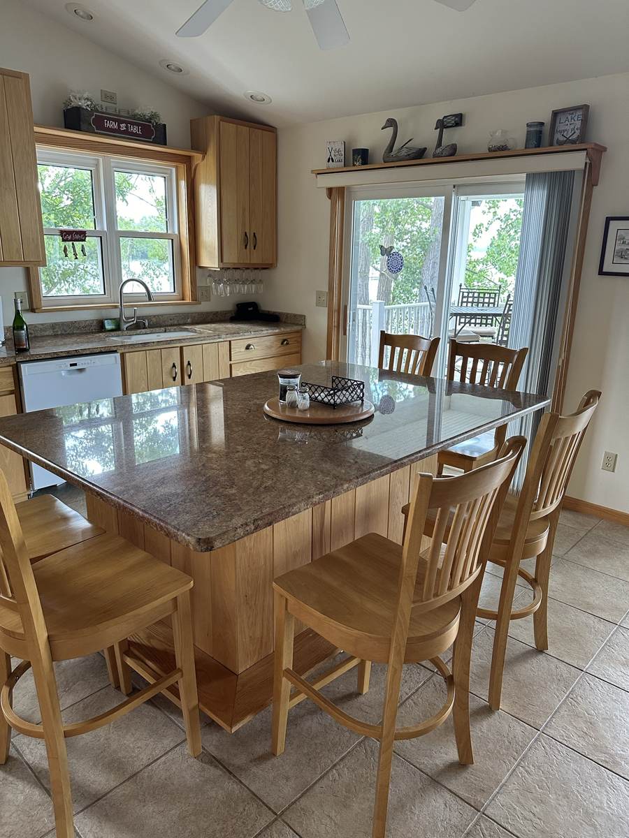 Kitchen island with seating for six and a peek at the lake