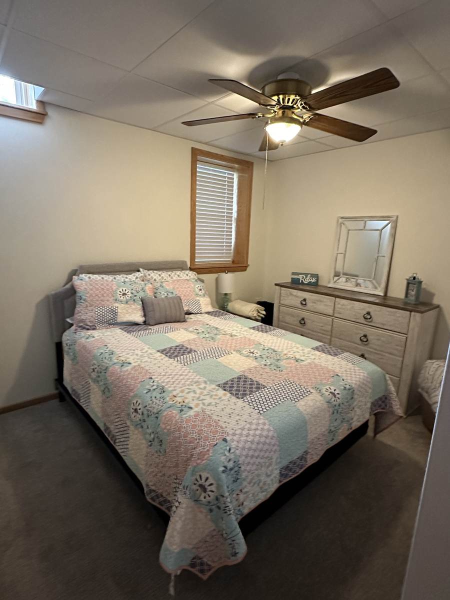 Bedroom with a cheerful patchwork quilt