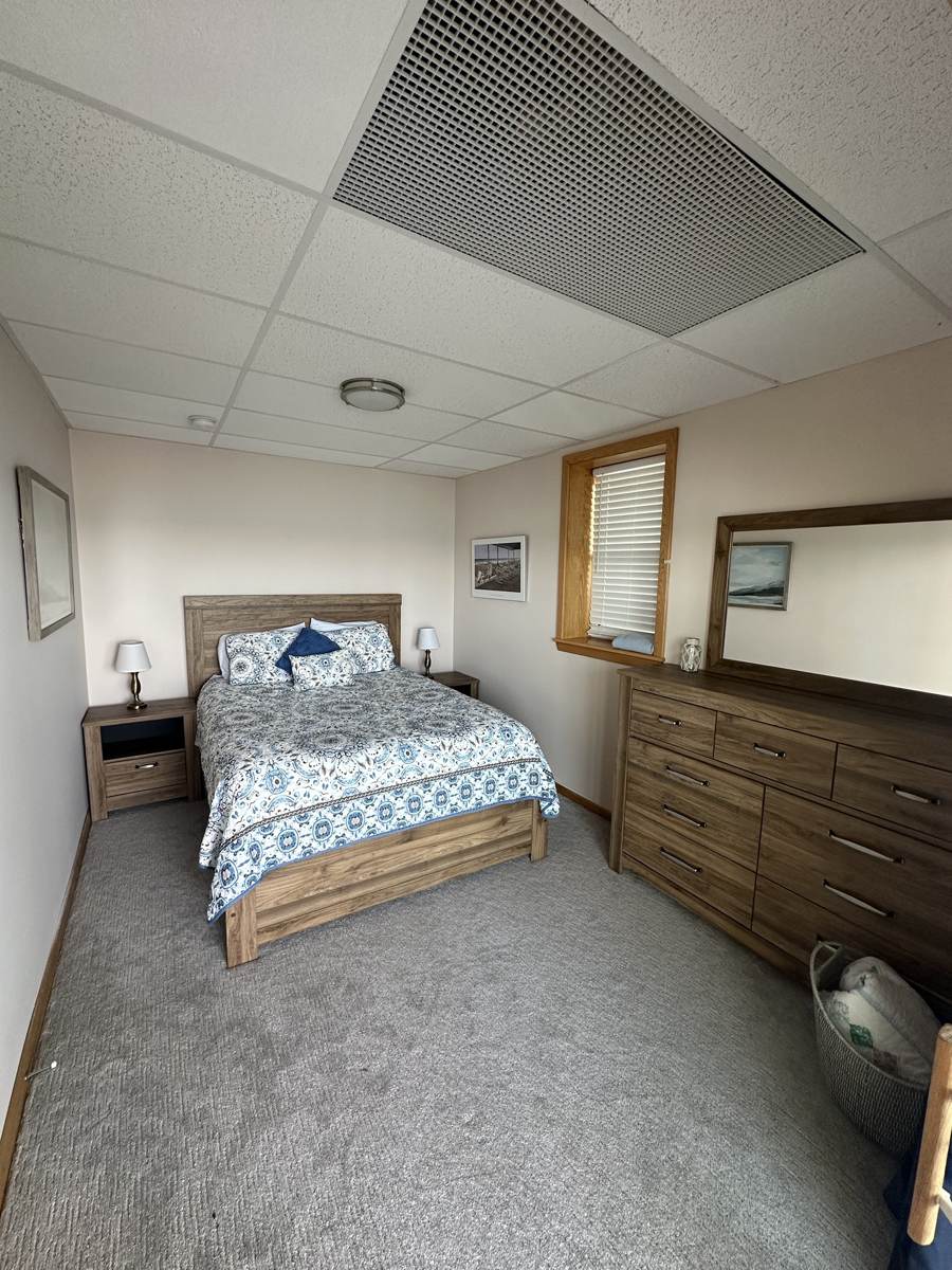 Bedroom with a full dresser and plenty of space