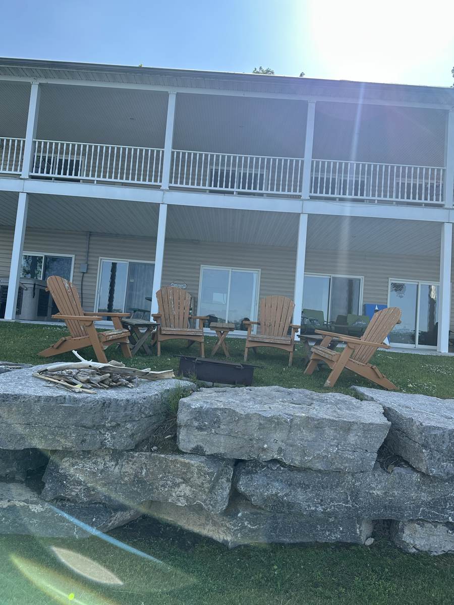 Adirondack chairs around the fire pit